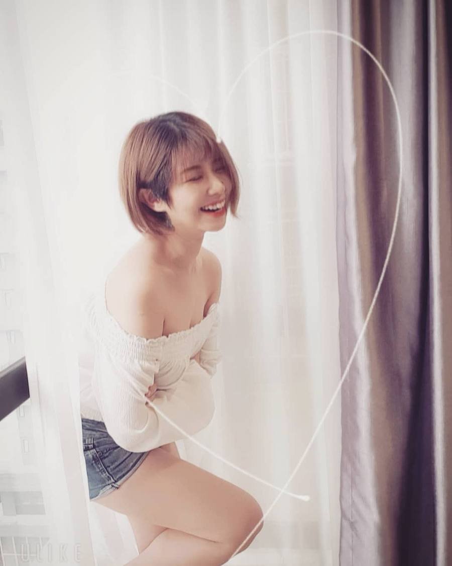 Pauline Tan by a window.